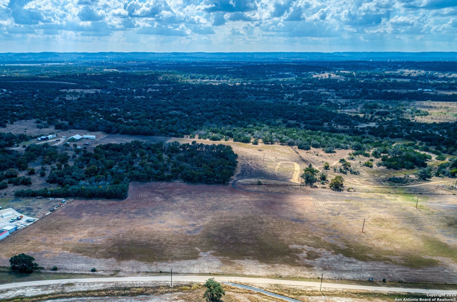 261 Watering Hole Trail Bandera, TX 78003 - Photo 8 of 24 a view of a yard with an outdoor space