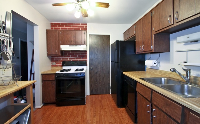 29 Stanton Court, Unit C2 Schaumburg, IL 60193 - Photo 4 of 9 a kitchen with stainless steel appliances granite countertop a sink stove and refrigerator