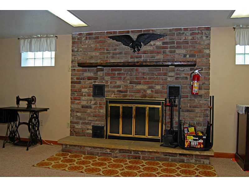 40 Glenn Way McKees Rocks, PA 15136 - Photo 13 of 24 Basement/Game Room. Wood burning fireplace.