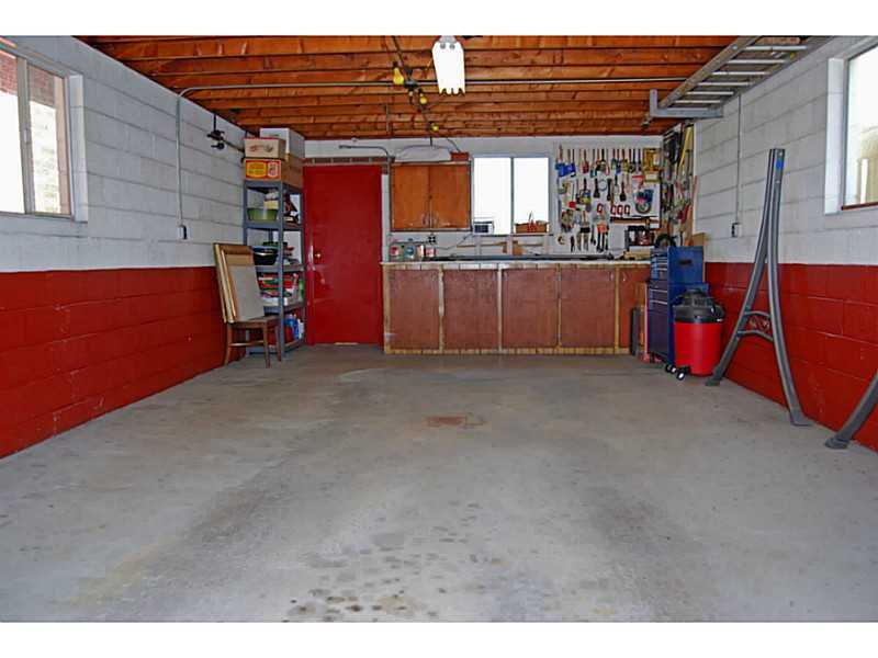 40 Glenn Way McKees Rocks, PA 15136 - Photo 23 of 24 Parking Lot/Garage. Garage has electrical service and a work area with storage.