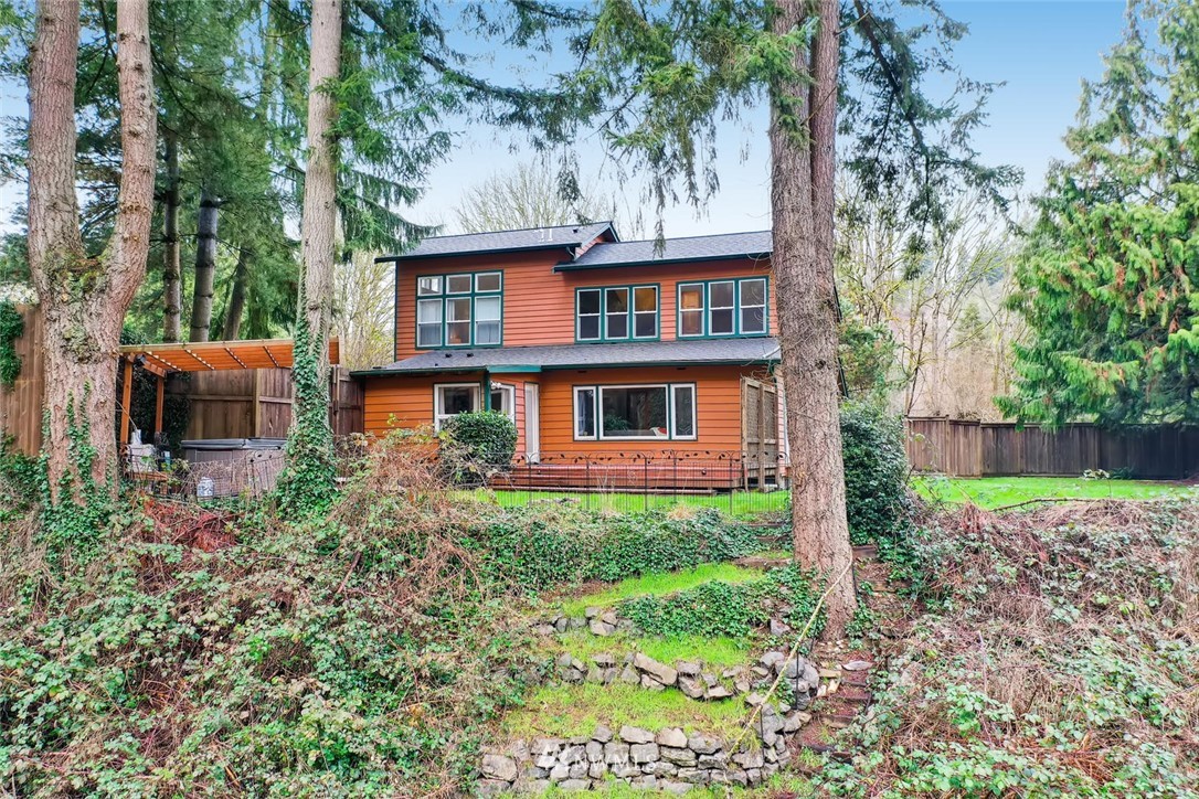 3427 Southeast 7th Street Renton, WA 98058 - Photo 2 of 32 a front view of a house with garden