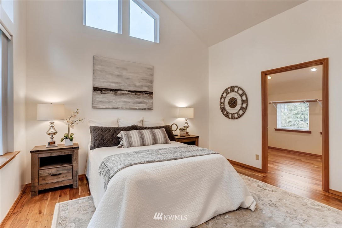 3427 Southeast 7th Street Renton, WA 98058 - Photo 19 of 32 a bed room with a bed and a painting on the wall