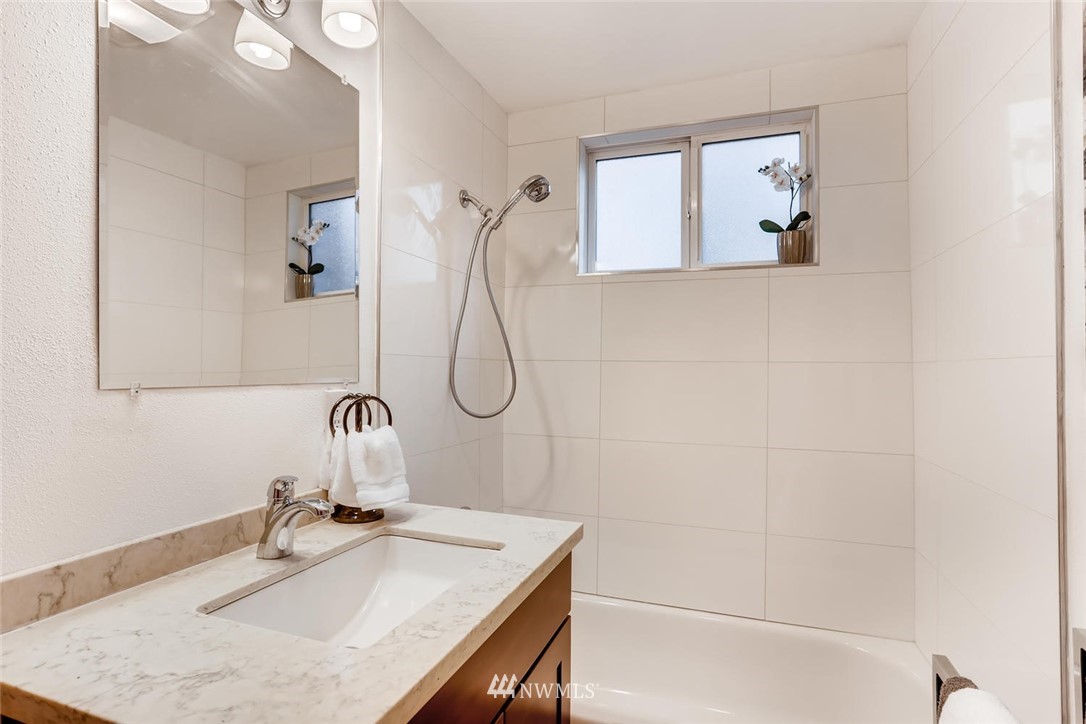 3427 Southeast 7th Street Renton, WA 98058 - Photo 29 of 32 a bathroom with a sink vanity and a mirror