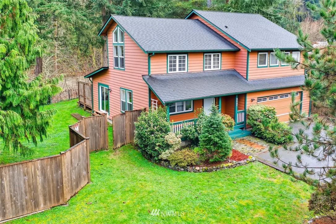 3427 Southeast 7th Street Renton, WA 98058 - Photo 4 of 32 a front view of a house with a yard