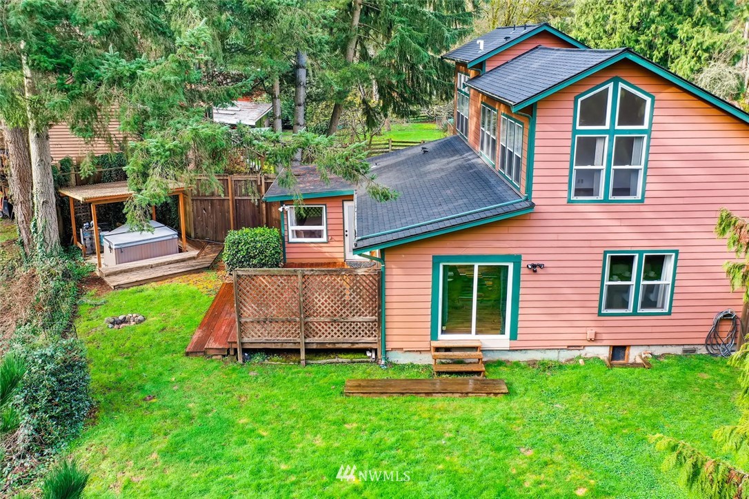 3427 Southeast 7th Street Renton, WA 98058 - Photo 5 of 32 a front view of a house with a yard