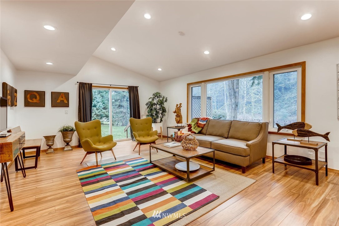 3427 Southeast 7th Street Renton, WA 98058 - Photo 10 of 32 a living room with furniture a rug and a table