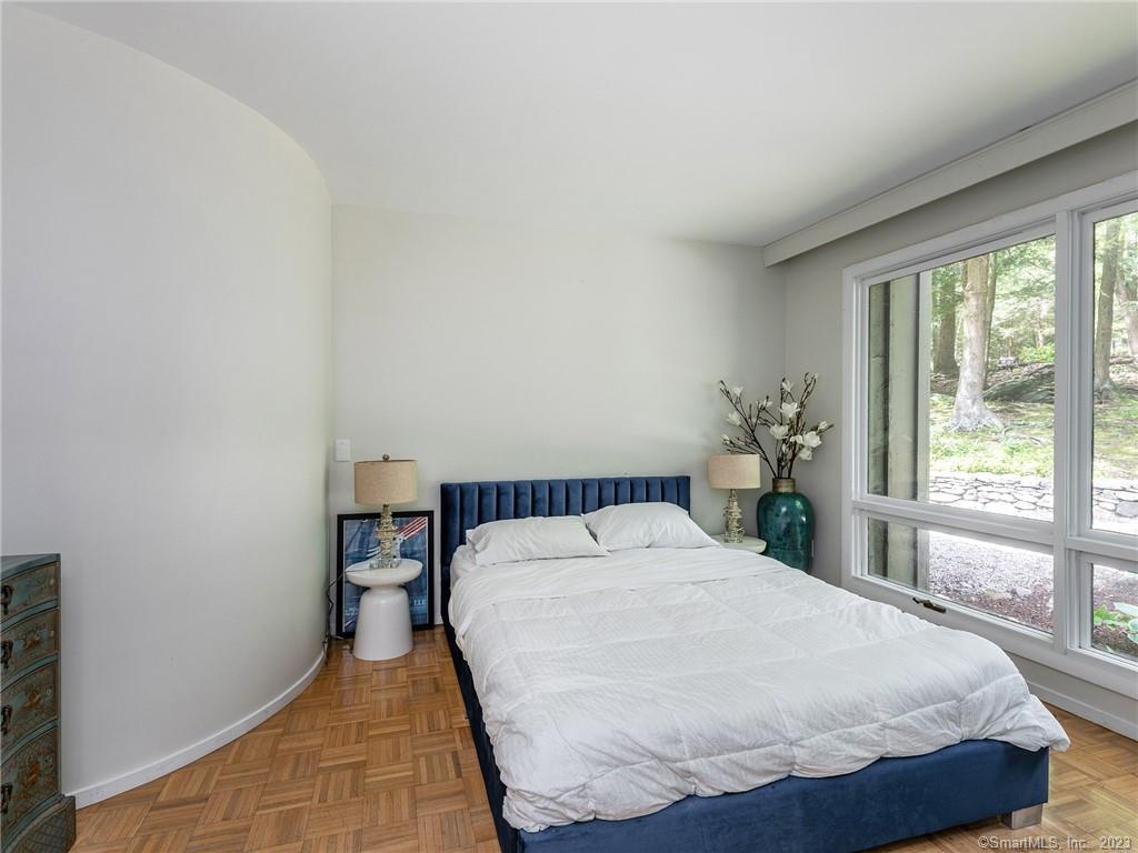 95 Shinar Mountain Road Washington, CT 06794 - Photo 13 of 28 a bed sitting in a bedroom next to a window