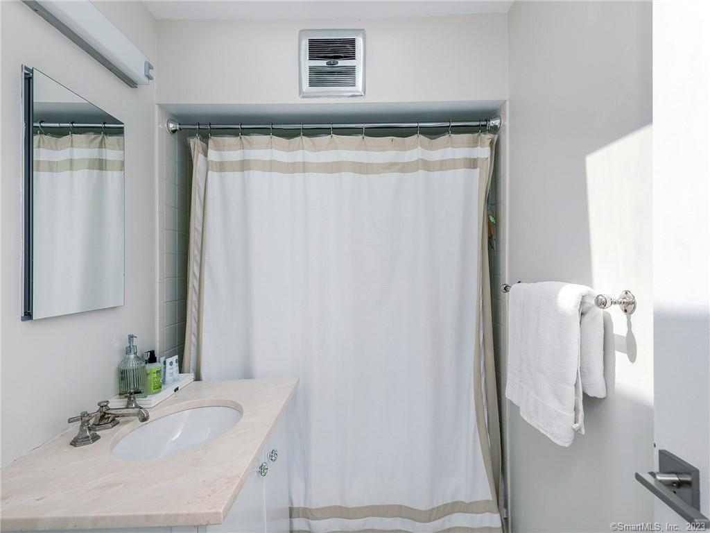 95 Shinar Mountain Road Washington, CT 06794 - Photo 16 of 28 a bathroom with a sink and a mirror