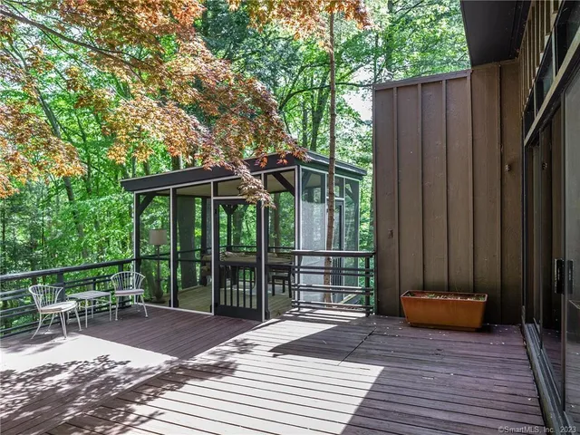 a patio with table and chairs