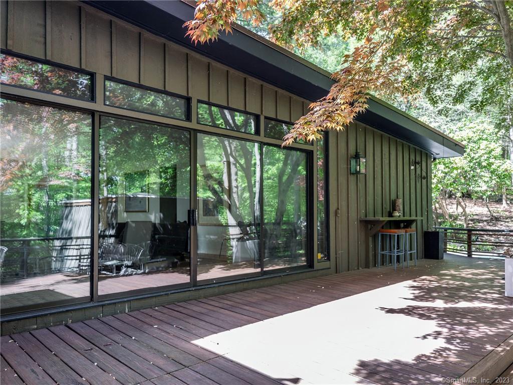 95 Shinar Mountain Road Washington, CT 06794 - Photo 23 of 28 a backyard of a house with seating space and deck