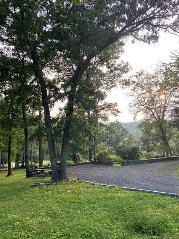 a view of outdoor space with deck area and trees