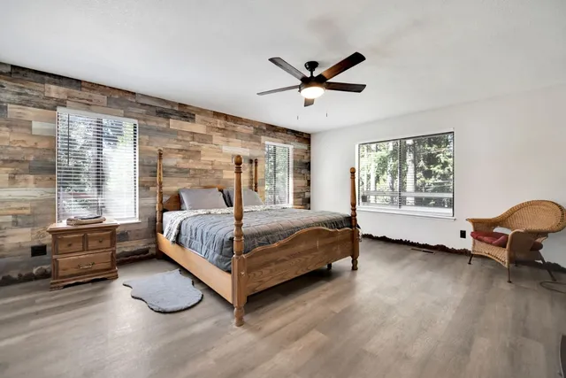 a living room with a couch and wooden floor
