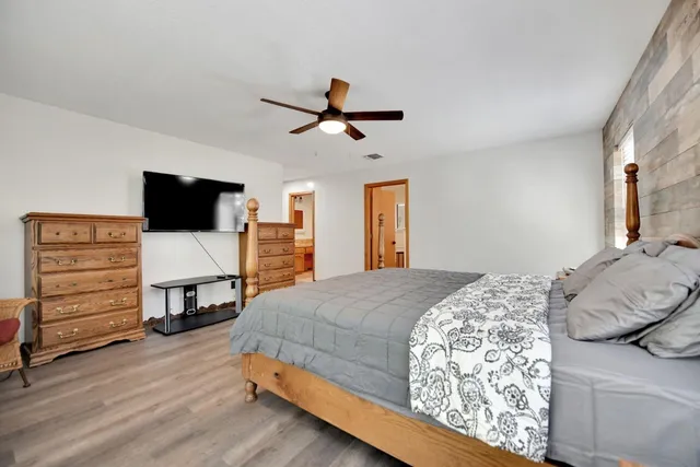a room with furniture and view of kitchen