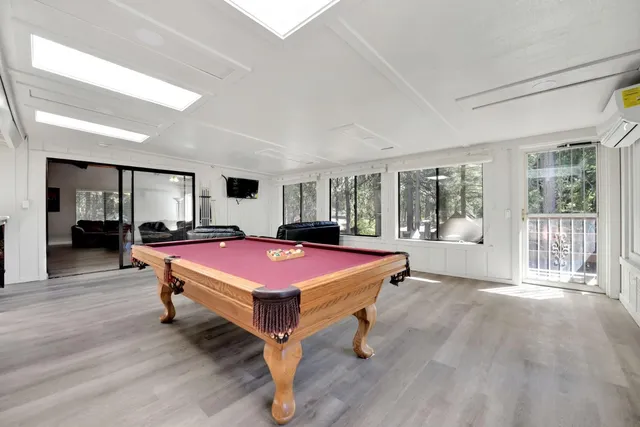 a dining room with furniture and a window