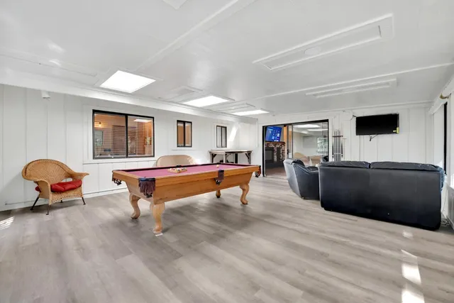 a kitchen with stainless steel appliances granite countertop a sink stove and wooden cabinets