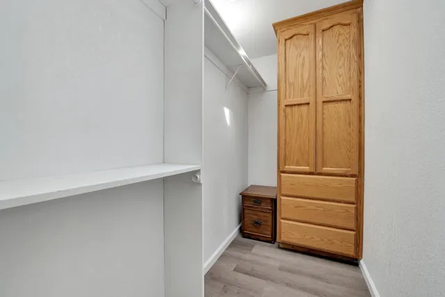 a dining room with furniture and a floor to ceiling window