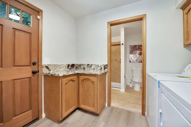 a view of a livingroom with furniture and a window