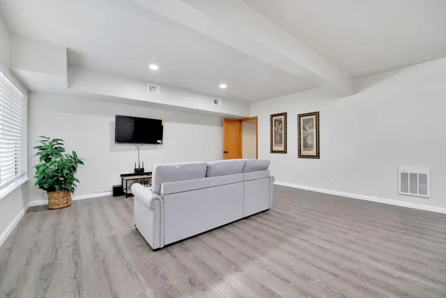 a living room with furniture and a rug