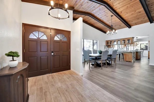 a kitchen with stainless steel appliances granite countertop a stove and cabinets