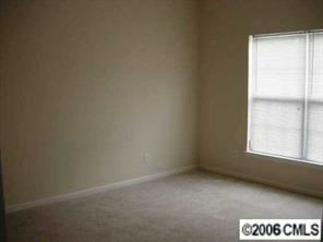 3517 Summerfield Ridge Lane Matthews, NC 28105 - Photo 7 of 8 a view of an empty room and a window
