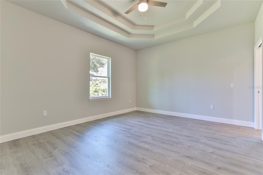 9 Seton Place, Unit A Palm Coast, FL 32164 - Photo 15 of 31 wooden floor in an empty room with a window