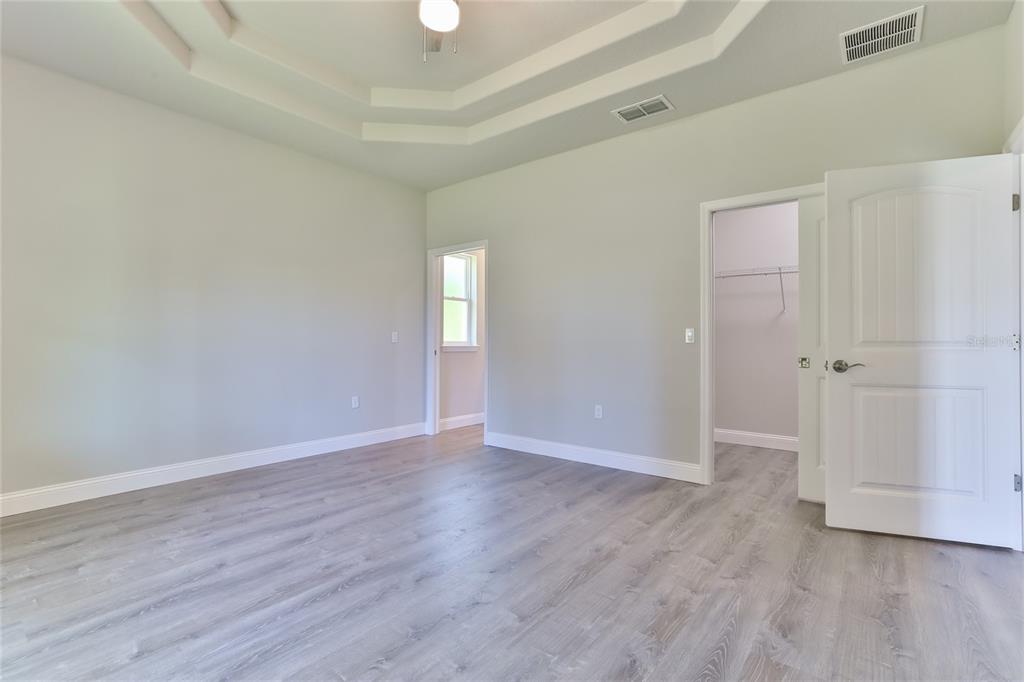 9 Seton Place, Unit A Palm Coast, FL 32164 - Photo 16 of 31 an empty room with wooden floor
