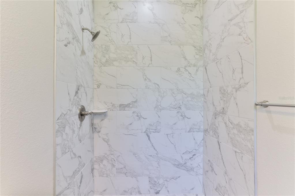 9 Seton Place, Unit A Palm Coast, FL 32164 - Photo 19 of 31 a bathroom with a shower