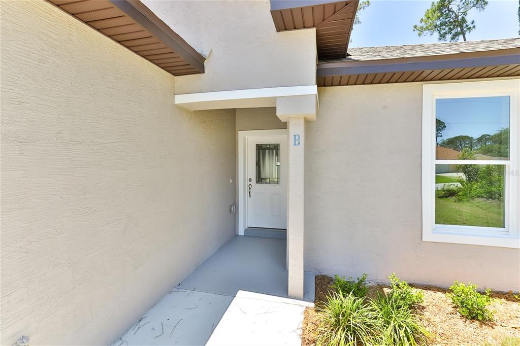 9 Seton Place, Unit A Palm Coast, FL 32164 - Photo 4 of 31 a view of a front door of the house
