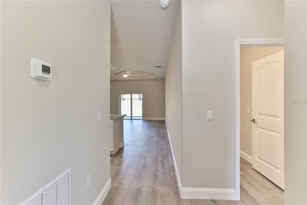 9 Seton Place, Unit A Palm Coast, FL 32164 - Photo 5 of 31 a view of a hallway with wooden floor