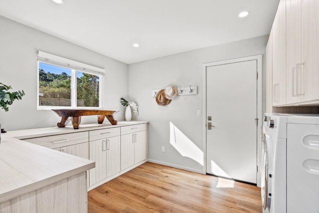 a kitchen with a refrigerator and a sink