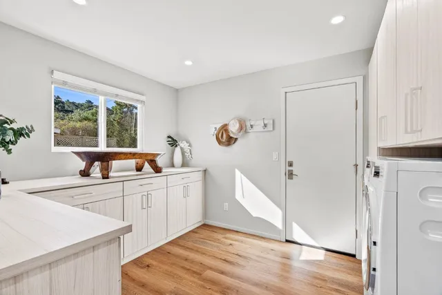 a kitchen with a refrigerator and a sink