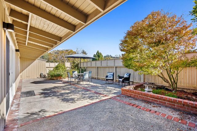 a view of a backyard with a sitting area