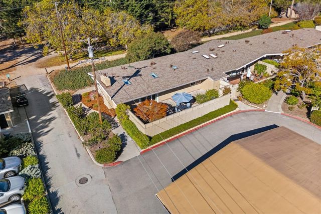 an aerial view of a house with a swimming pool