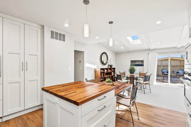 a kitchen with a table and chairs in it