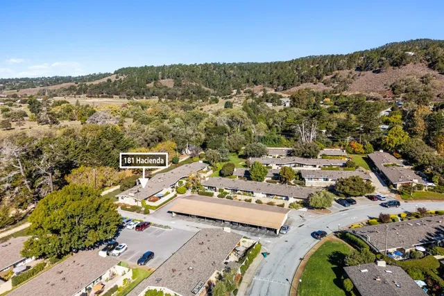an aerial view of residential houses with outdoor space