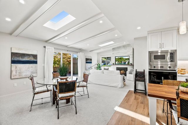 a living room with fireplace furniture and a flat screen tv