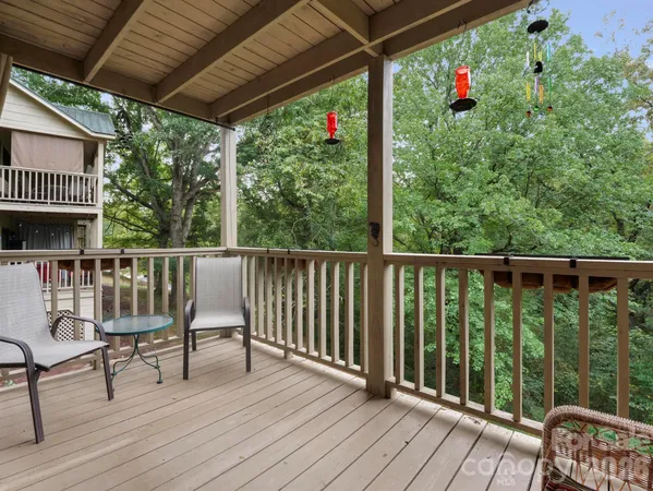 a view of a balcony with wooden floor