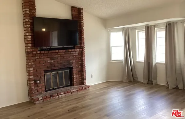 a kitchen with a stove and a microwave