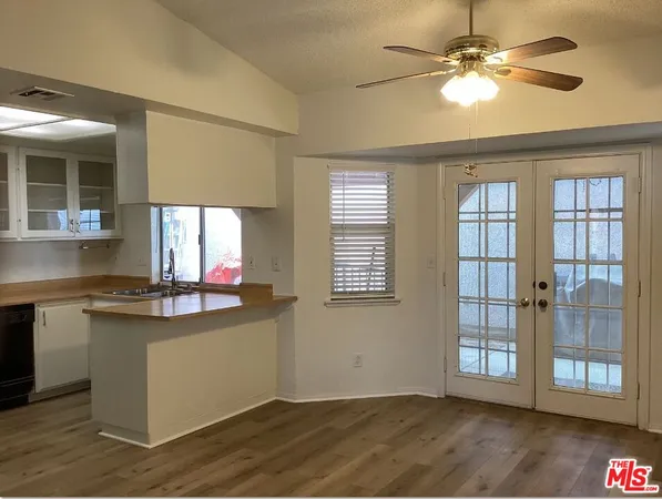 an empty room with a empty space and a window