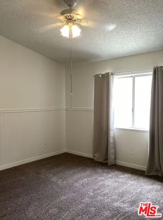 a view of a chandelier fan in a room