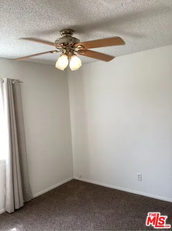 a view of bedroom with furniture and wooden floor