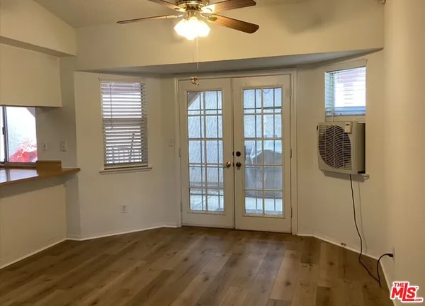 a kitchen with stainless steel appliances a refrigerator stove microwave and cabinets