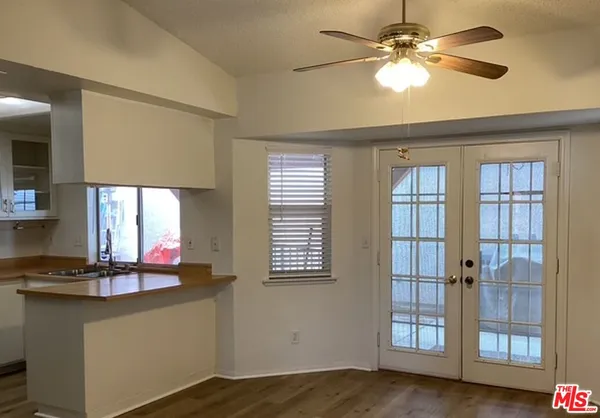 a kitchen with stainless steel appliances granite countertop a stove and a microwave