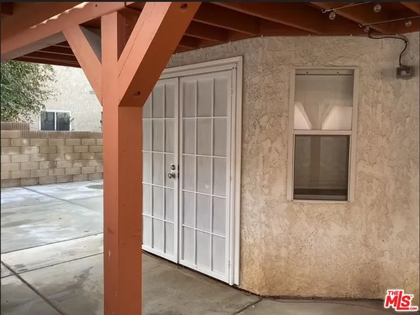 a view of hallway with wooden floor