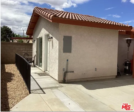 a bathroom with a toilet and a shower curtain