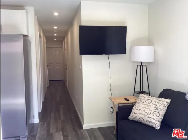 a bedroom with a bed and dresser