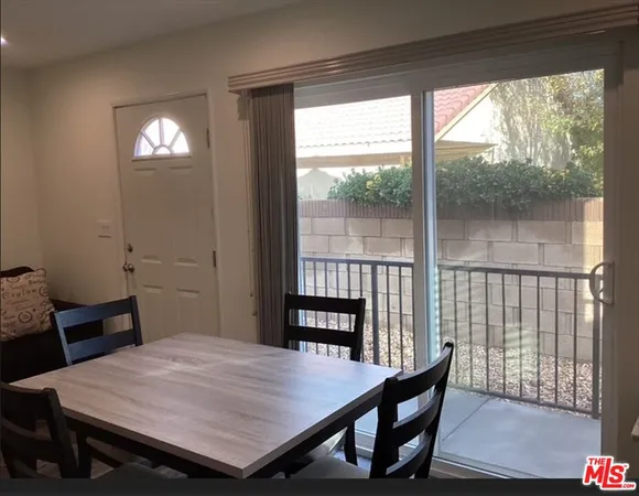 a bathroom with a toilet and a shower curtain
