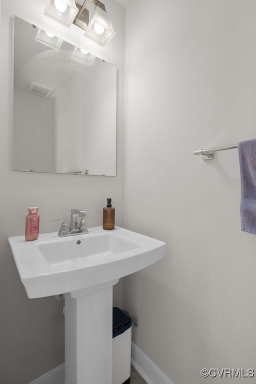 2117 Borough Ridge Street Richmond, VA 23225 - Photo 12 of 27 Bathroom featuring a sink and baseboards