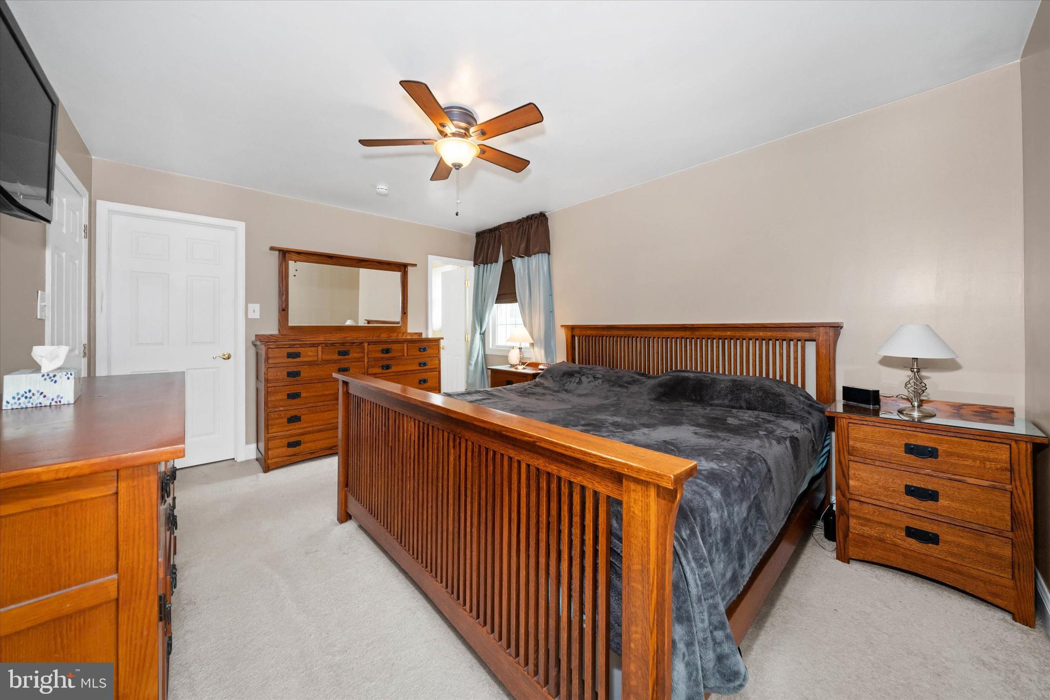 1331 Cherry Tree Road Aston, PA 19014 - Photo 21 of 40 a spacious bedroom with a bed and a chandelier