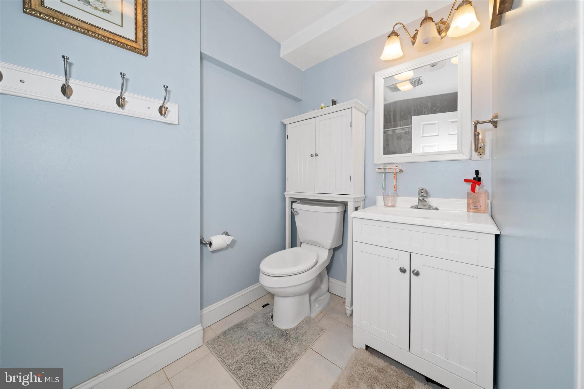 1331 Cherry Tree Road Aston, PA 19014 - Photo 23 of 40 a bathroom with a sink toilet and vanity